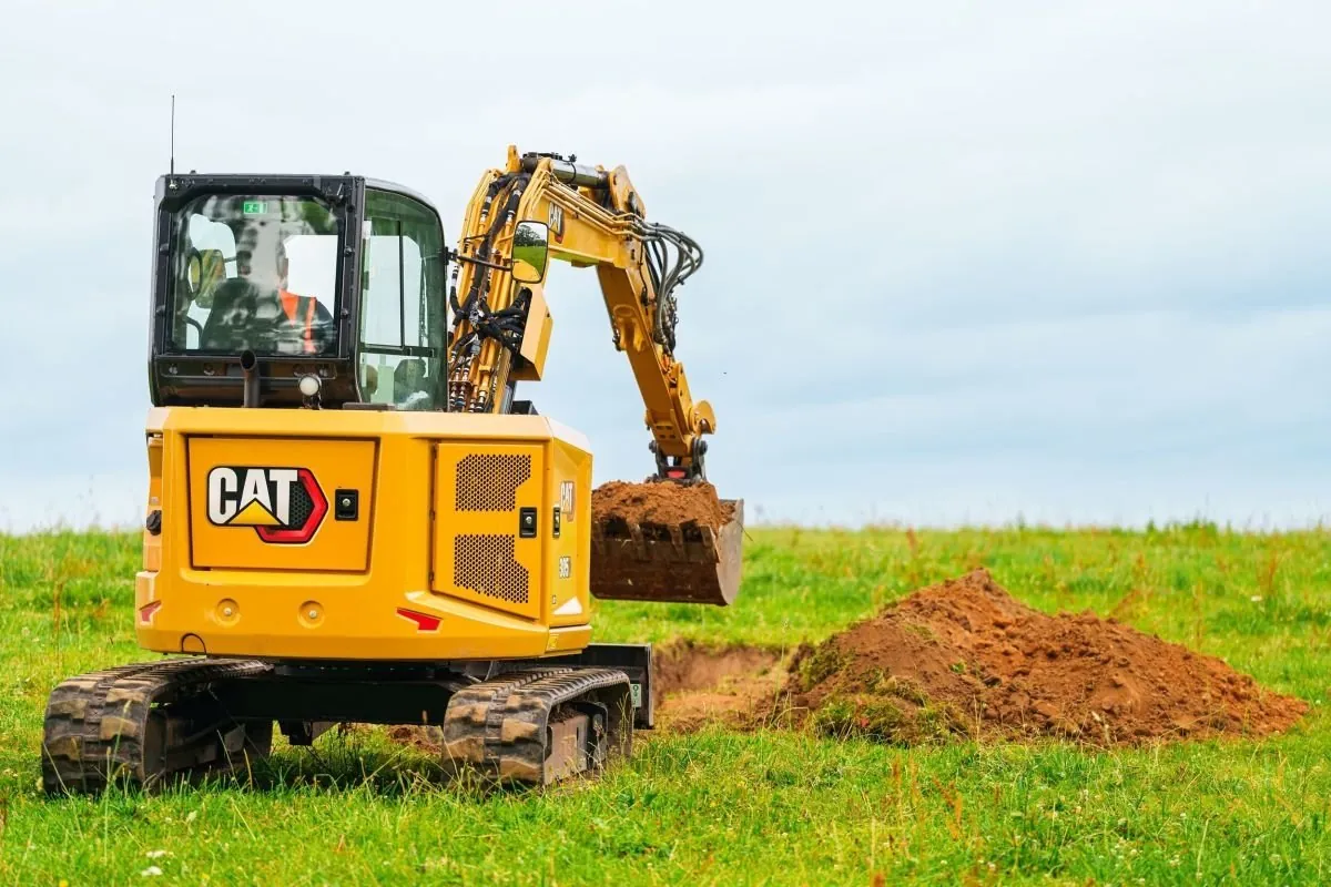 CAT 305 mini excavator digging a drainage trench on a Middle Tennessee excavation job
